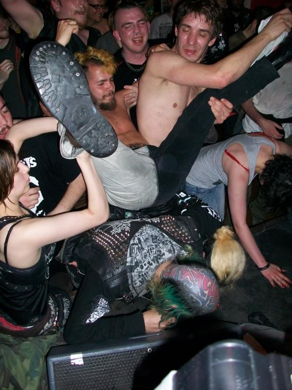 Stagediver lands on the crowd at Oi Polloi gig at the Boston Arms, Tufnell Park, London 2011