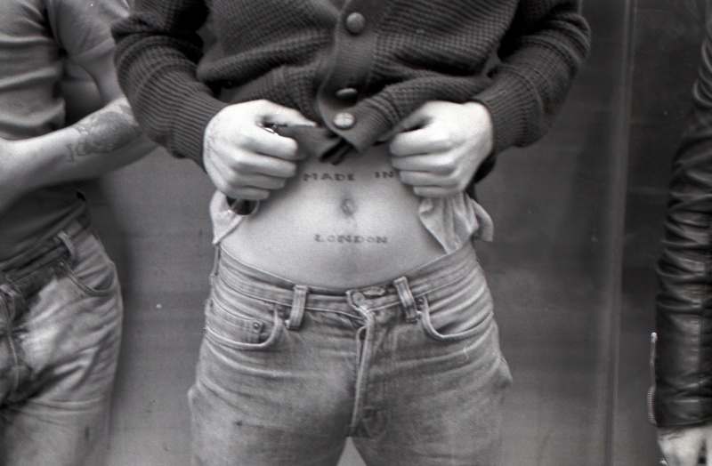 Skinhead showing 'Made in London' tattoo, King's Rd, London, 80s ST#380