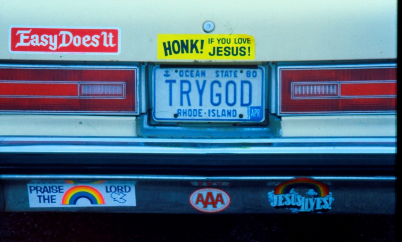 'TRYGOD' licence plate and assorted Christian bumper stickers, Providence, Rhode Island, USA, 1984 [photo © Ted Polhemus]
