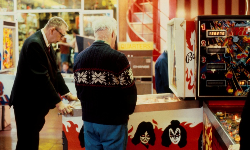 Two gentlemen playing the KISS pinball machine (by Bally Manufacturing Co.) in Palace Amusements', Asbury Park, New Jersey, USA, early 1980s [photo © Ted Polhemus]